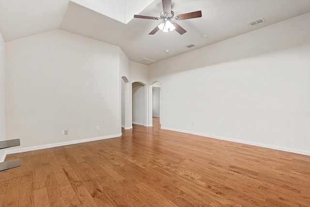 unfurnished living room featuring vaulted ceiling, ceiling fan, and light hardwood / wood-style floors