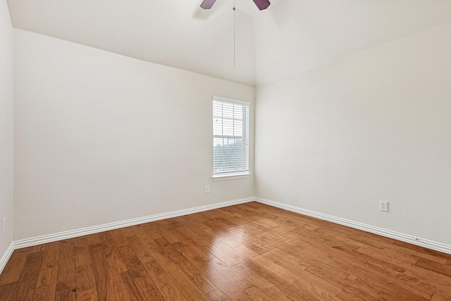 empty room with ceiling fan and hardwood / wood-style floors