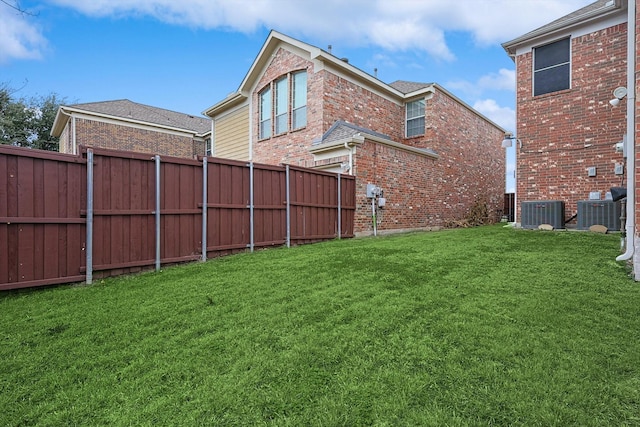 view of yard featuring central AC