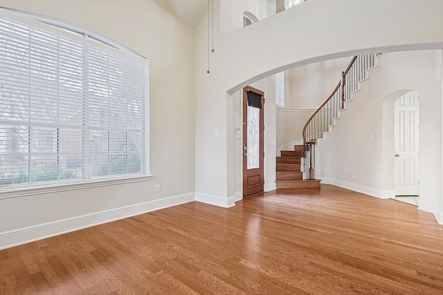 entryway with hardwood / wood-style flooring