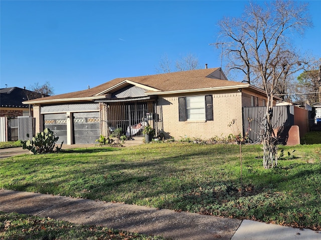 view of front facade with a front yard and a garage