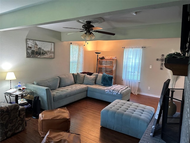 living room with ceiling fan, plenty of natural light, and dark hardwood / wood-style floors