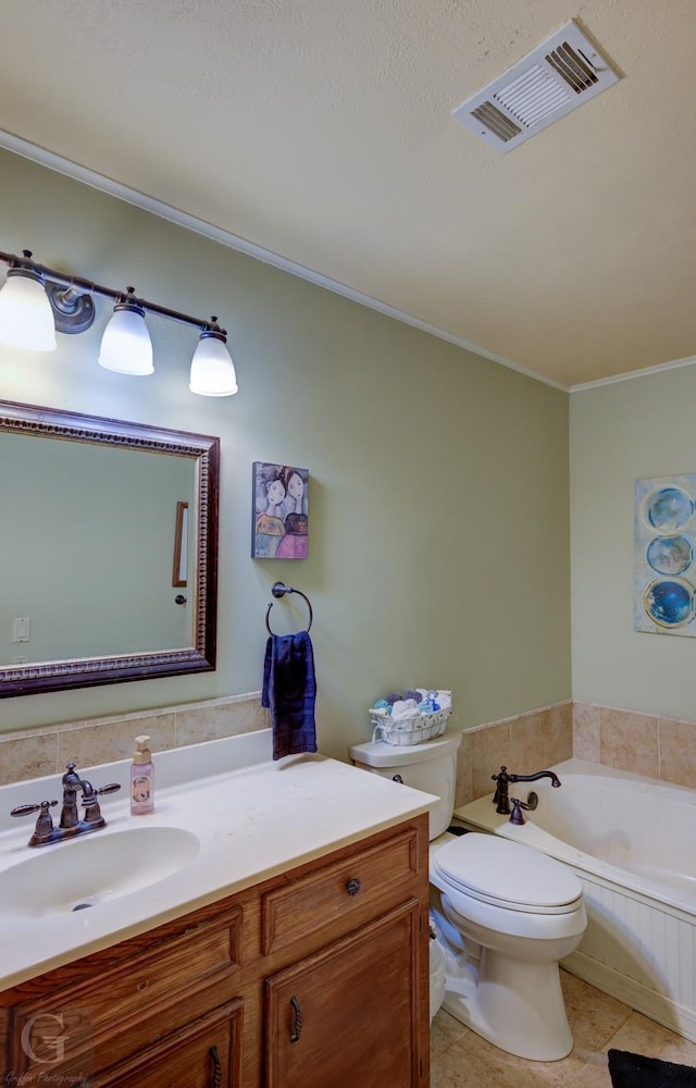 bathroom featuring tile patterned floors, toilet, crown molding, vanity, and a bath