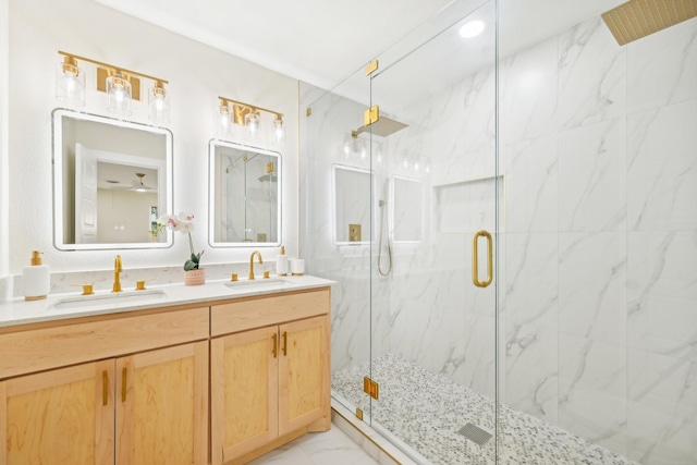 bathroom featuring vanity and a shower with door