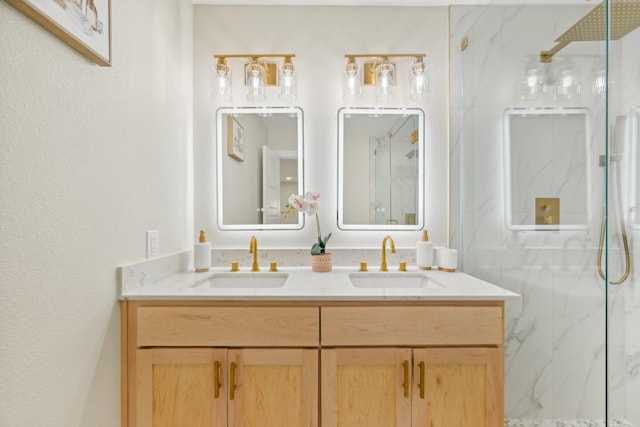 bathroom featuring vanity and an enclosed shower