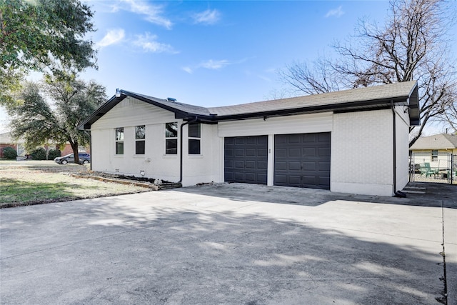 ranch-style house featuring a garage