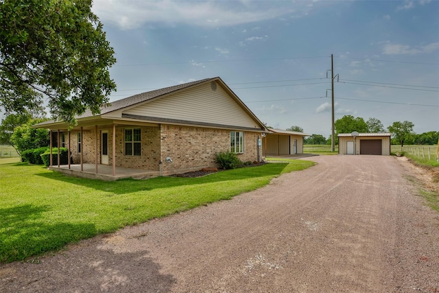368 Hawkins Rd, Whitesboro, TX 76273 - view of property exterior featuring brick siding, a lawn, a garage, and covered porch