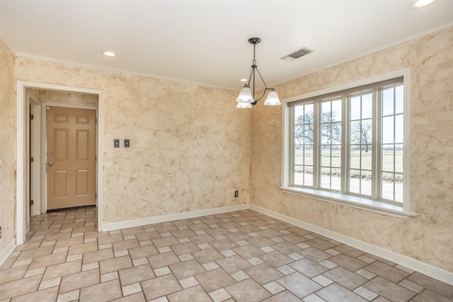 unfurnished dining area with crown molding and an inviting chandelier