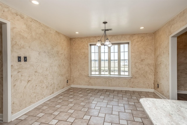 unfurnished dining area featuring a chandelier