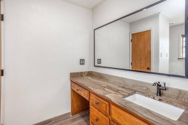 bathroom with vanity and crown molding