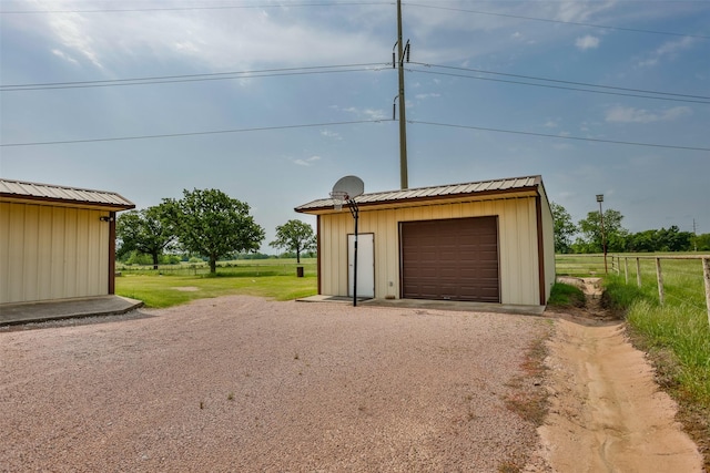 368 Hawkins Rd, Whitesboro, TX 76273 - detached garage with fence and dirt driveway