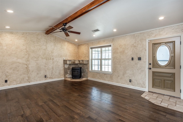 368 Hawkins Rd, Whitesboro, TX 76273 - unfurnished living room featuring a ceiling fan, hardwood / wood-style flooring, a wood stove, baseboards, and ornamental molding