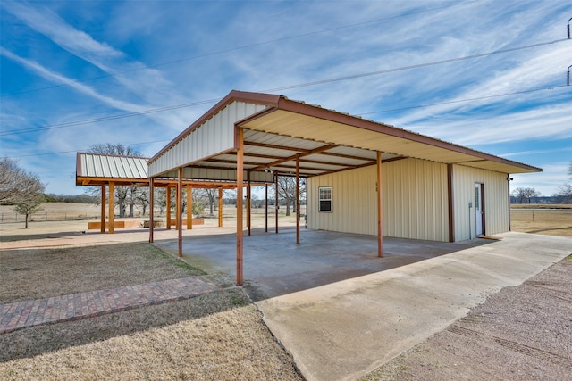 view of vehicle parking featuring a carport