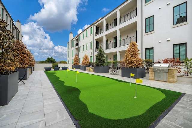 view of property's community with a patio area