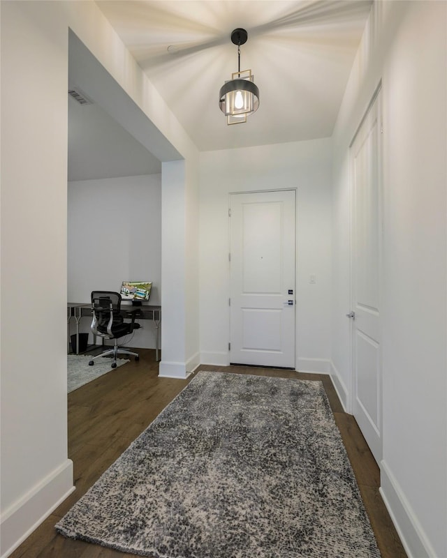 entrance foyer with dark hardwood / wood-style floors