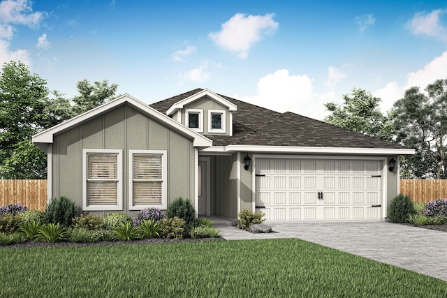 view of front facade with a front yard and a garage