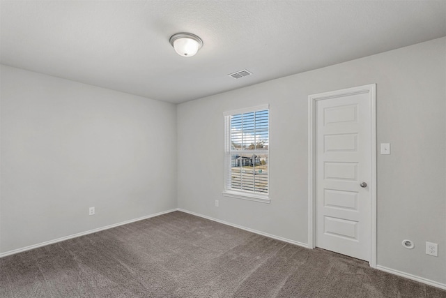 unfurnished room featuring carpet flooring