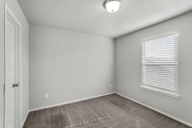 empty room with carpet flooring