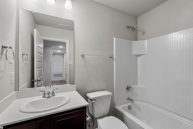 full bathroom with toilet, vanity, and shower / washtub combination