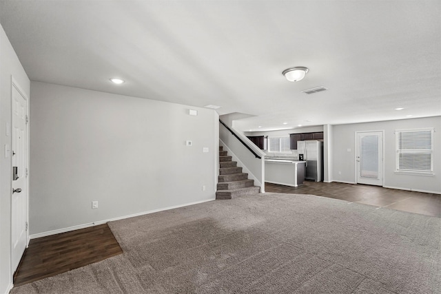 interior space with dark colored carpet