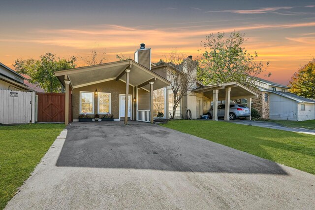 view of front of house featuring a front yard and a carport