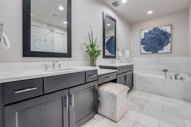 bathroom featuring vanity, separate shower and tub, and tile patterned flooring