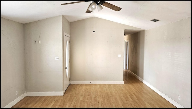 spare room with ceiling fan, light hardwood / wood-style flooring, and lofted ceiling