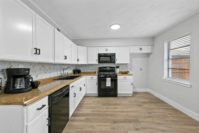 spare room with ceiling fan and light hardwood / wood-style flooring