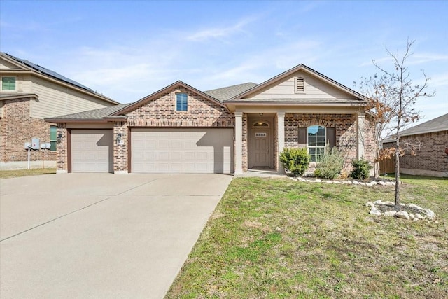 view of front of property featuring a garage and a front lawn