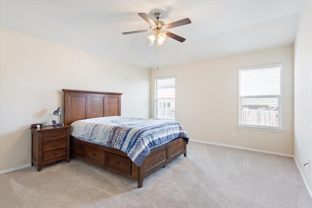 bedroom featuring ceiling fan and light colored carpet