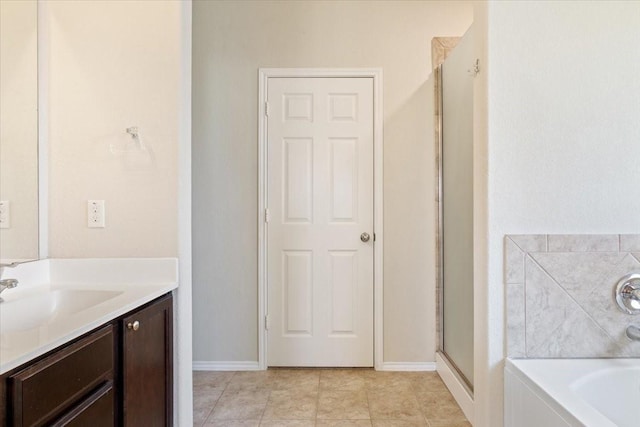 bathroom featuring vanity and shower with separate bathtub