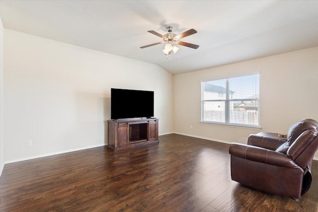 living area featuring ceiling fan, vaulted ceiling, and dark hardwood / wood-style floors