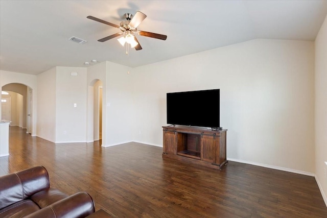 unfurnished living room with ceiling fan and dark hardwood / wood-style floors