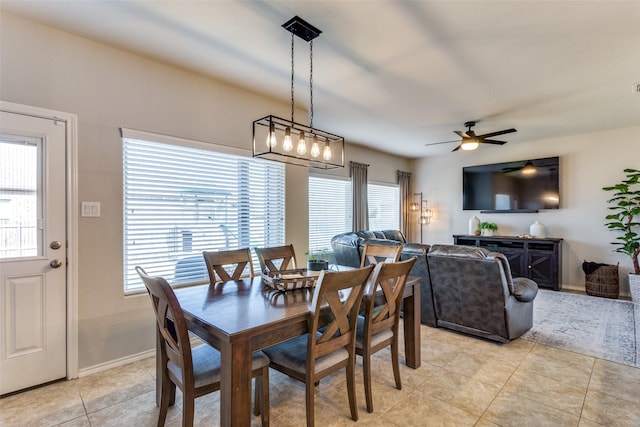 tiled dining area with ceiling fan