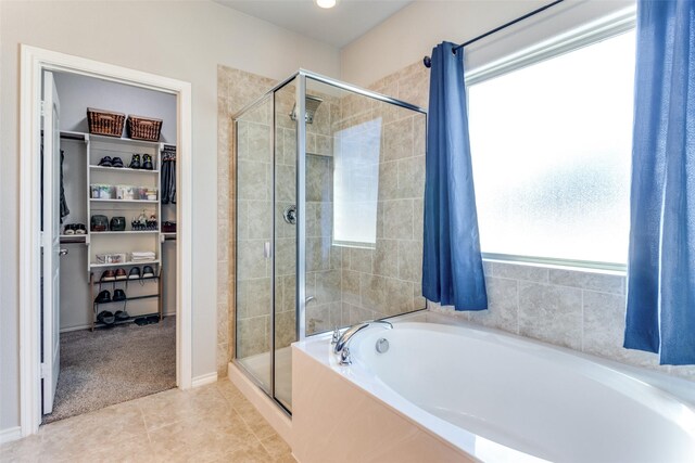 bathroom featuring tile patterned flooring and plus walk in shower