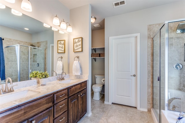 full bathroom with toilet, vanity, tile patterned floors, and plus walk in shower