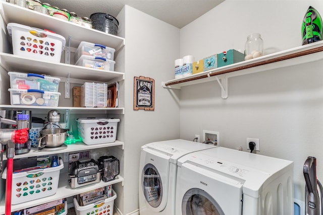 laundry room with washing machine and dryer