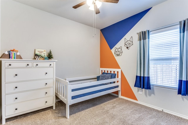 bedroom featuring light carpet and ceiling fan