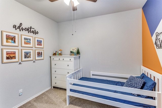 bedroom featuring ceiling fan and light carpet