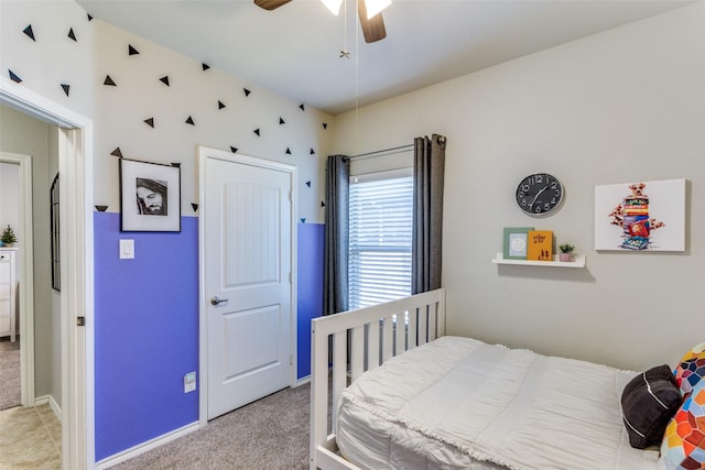 carpeted bedroom featuring ceiling fan