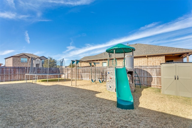 view of jungle gym with a trampoline