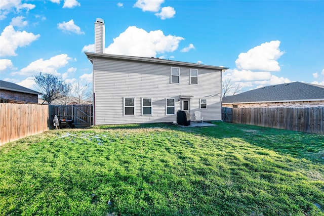 rear view of property featuring a yard