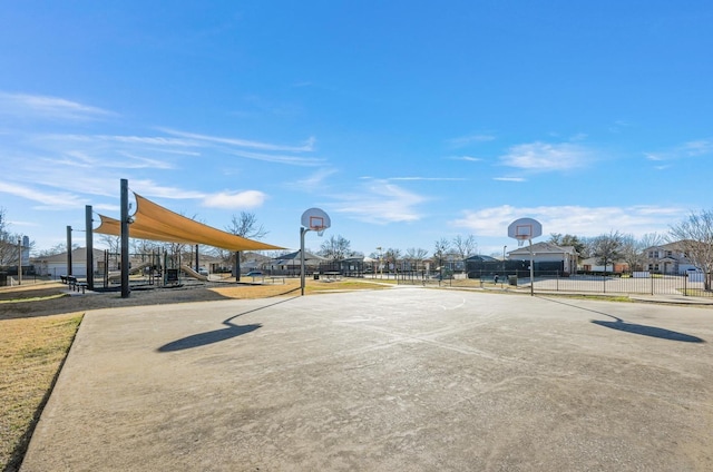 view of sport court with a playground