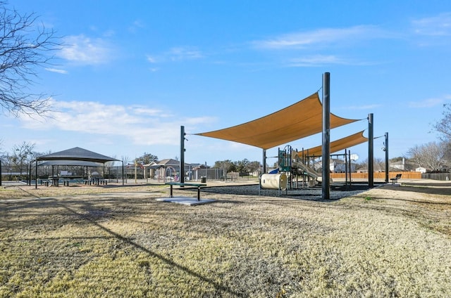 view of community featuring a playground and a yard