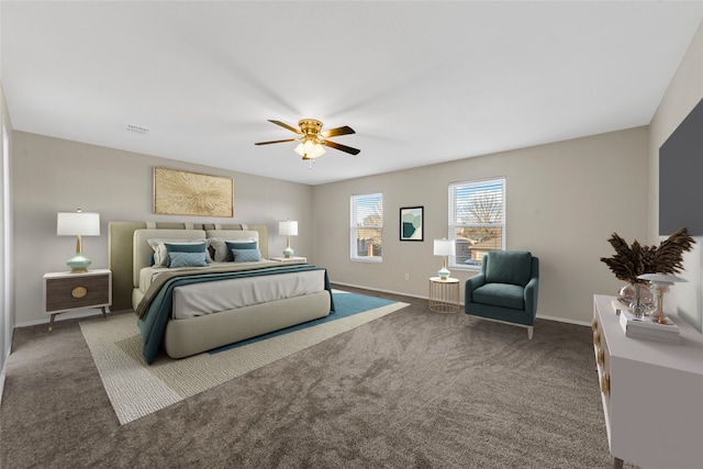 bedroom featuring ceiling fan and dark carpet