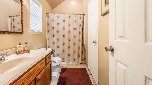 bathroom with toilet, a shower with shower curtain, lofted ceiling, tile patterned floors, and vanity