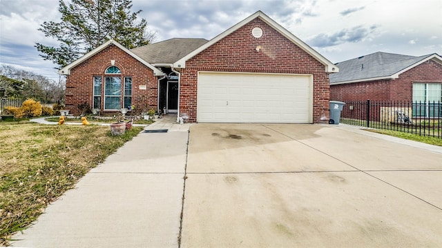 view of front facade with a front lawn and a garage