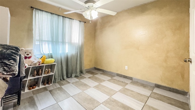 spare room featuring ceiling fan