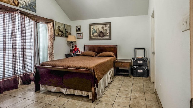 tiled bedroom with vaulted ceiling