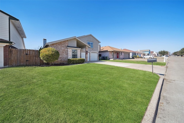 single story home featuring a front yard and a garage